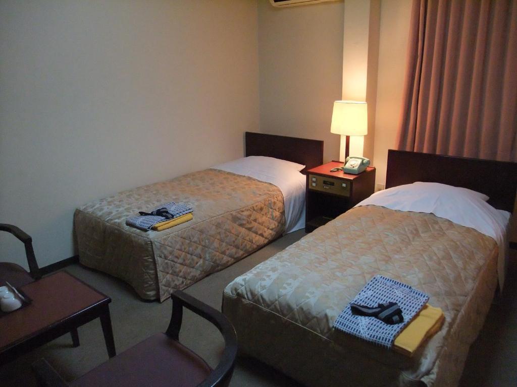 Hotel New Takahashi Takezono Цукуба Номер фото