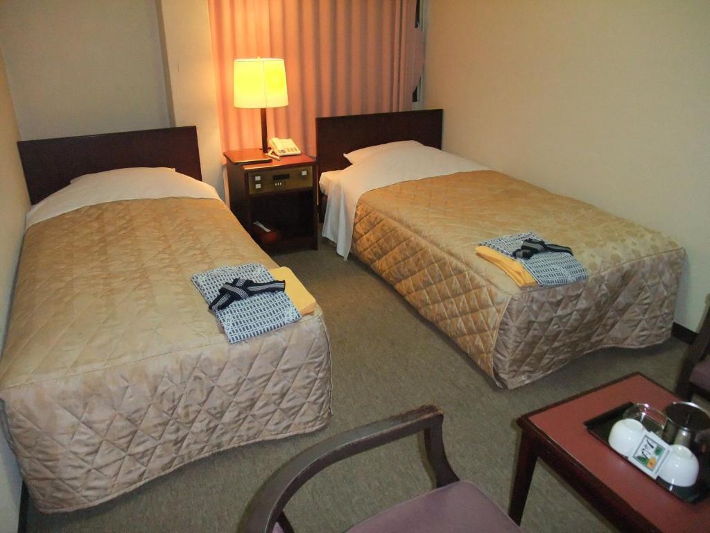 Hotel New Takahashi Takezono Цукуба Номер фото